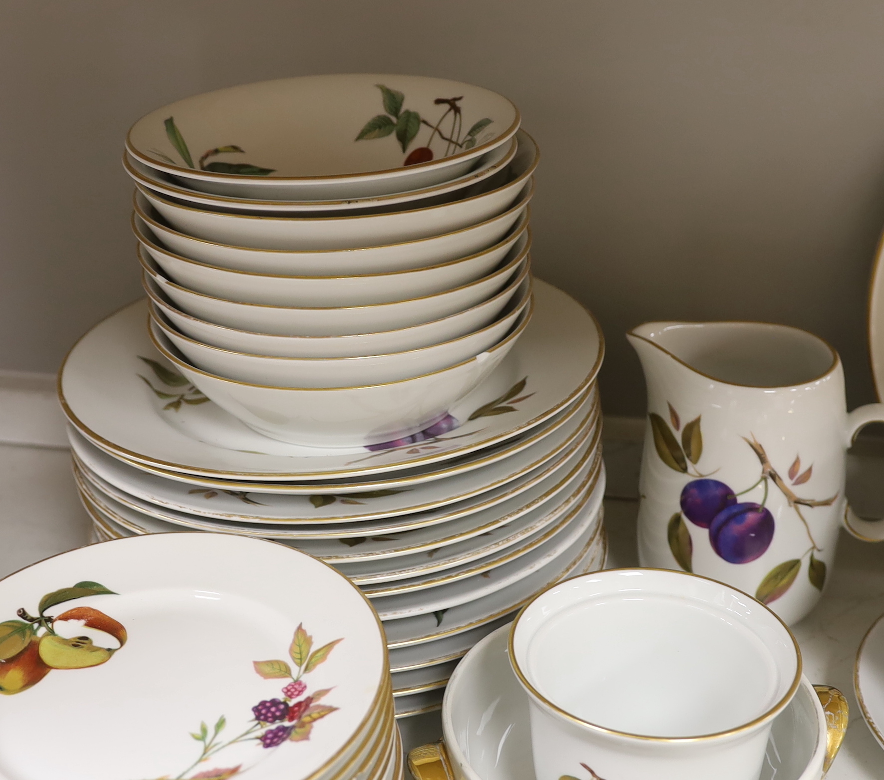 A large quantity of Worcester Evesham dinnerware, including; plates, bowls, serving dishes, jugs, flan, dishes, etc. (70 pieces)